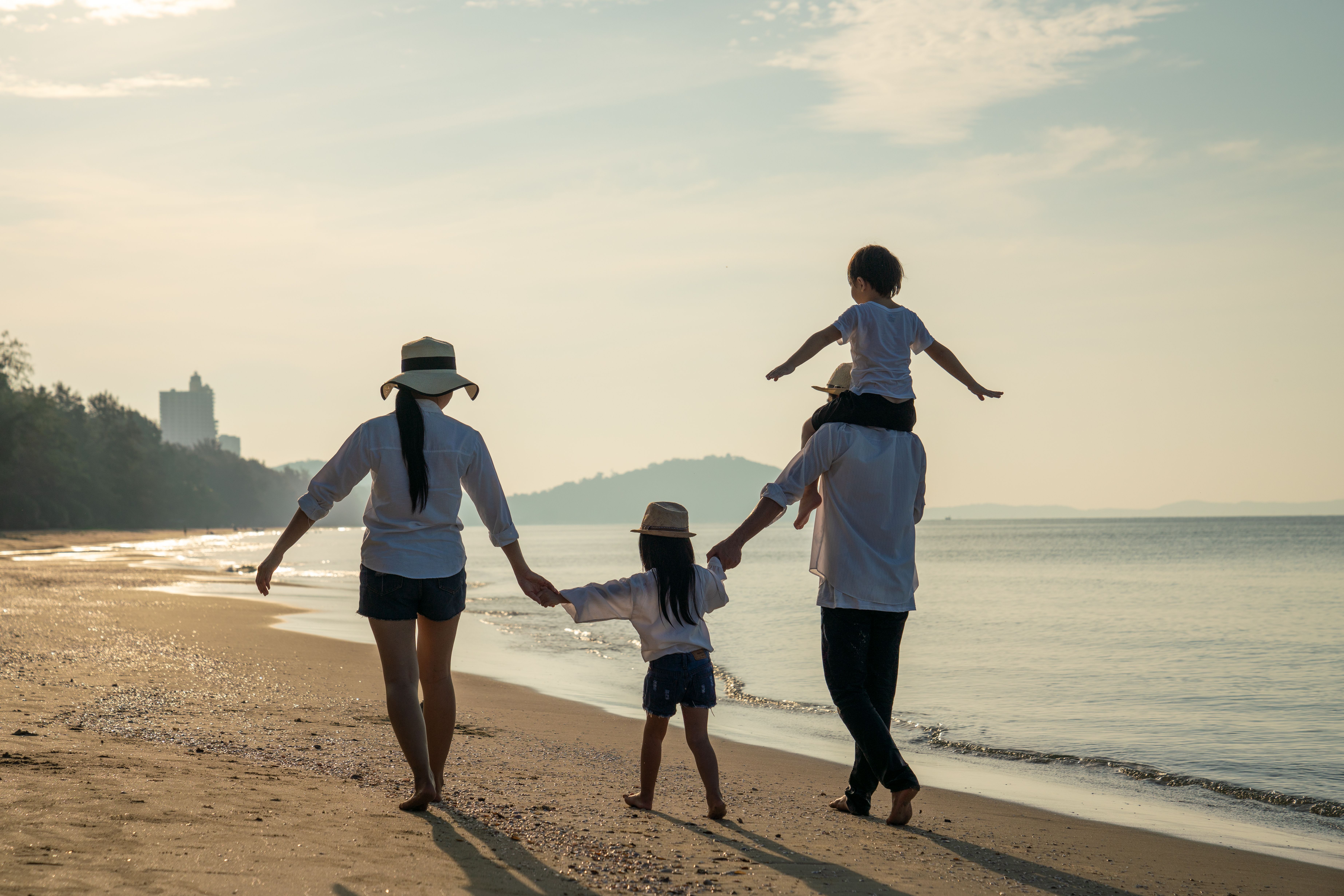 parents-with-children-enjoying-vacation-beach